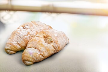 Tasty fresh Croissant bread on desk