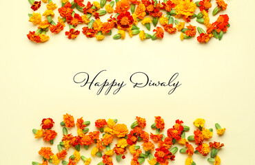 Greeting card for Diwali (Indian Festival of Lights) with marigold flowers on light background