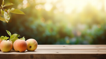 A couple of apples on a wooden surface, with a blurry background