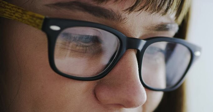 Woman, glasses and screen reflection for reading, optometry and wellness for eyesight in closeup. Person, lens and frame for healthy eyes, ophthalmology and thinking with vision, ideas and research