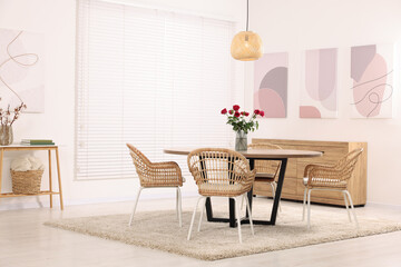 Stylish dining room interior with comfortable furniture