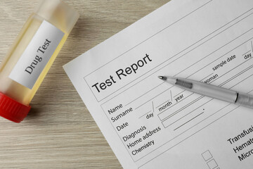 Drug test result form, container with urine sample and pen on wooden table, flat lay