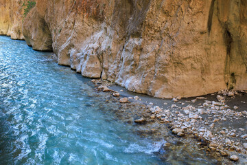 Saklikent Canyon in Turkey with mountain cold stormy water in the river. Natural attraction, popular place for tourists
