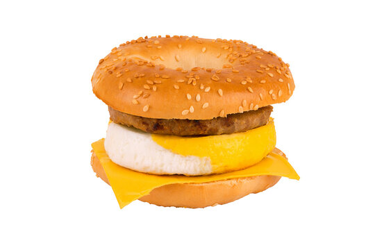Sandwich breakfast isolated on white background. Bagel, egg, cheese, and sausage.