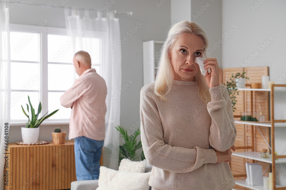 Sticker Crying mature woman after quarrel with her husband at home. Divorce concept