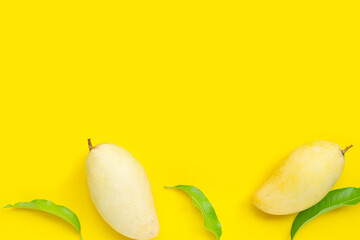 Tropical fruit, Mango on yellow background. Top view