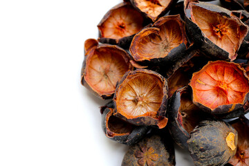 Dried mangosteen peels on white background.