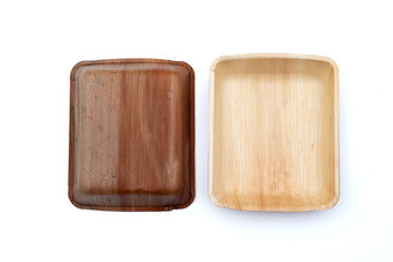 Betel palm leaf plates on white background.