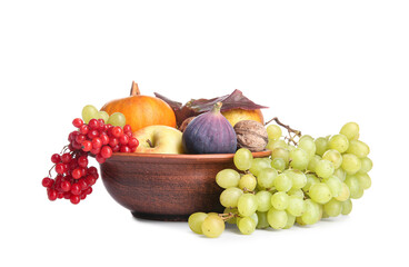 Bowl with different fresh fruits, pumpkin and berries on white background