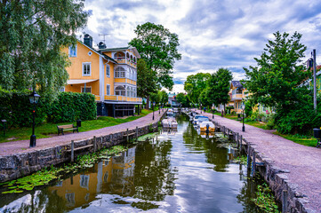Fototapeta na wymiar Trosa is an idyll of old fine wooden houses and a beautiful canal