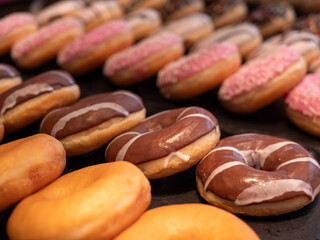 Nougat Glazed and Plain Donuts in a Bakery
