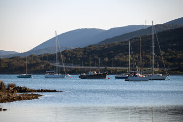 View of seven beautifully vintage different sailboats anchored in a bay in Croatia Europe.