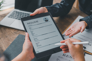 HR managers are interviewing job applicants who fill out their resume on the job application form...