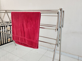 Red towel hanging on clothesline