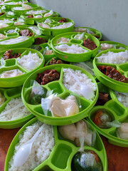 Prepared emlployee meals in round lunch boxes