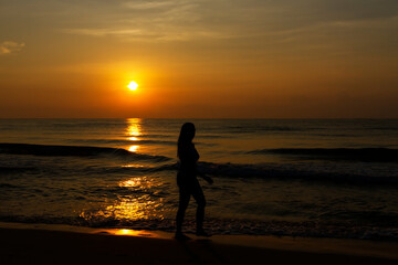 Fototapeta na wymiar Woman body big with bikini and sunrise on beach