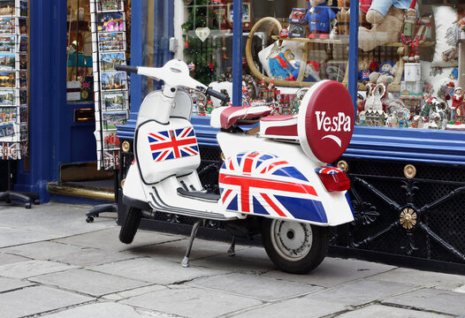 Mods Vespa scooter with Union Jack Flag painted on displayed at Jacks Of Bath Tourist Gift Shop in Bath,England.The photo was taken on 15th of Nov.2015