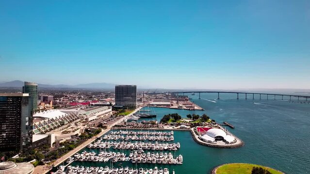 Trucking left aerial view of the San Diego Convention Center and the Rady Shell at Jacobs park.