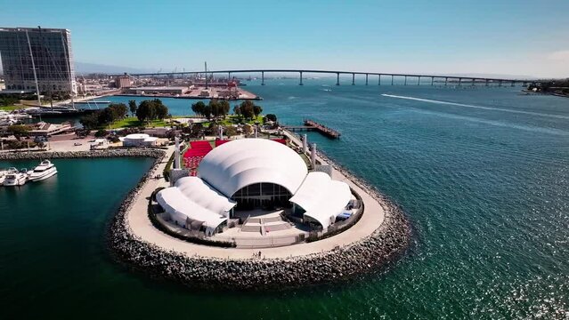 Flying around the Rady Shell at Jacobs Park in San Diego California with views of the harbor and Coronado Bridge.