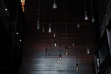 Hanging filament bulbs or lamps on the industrial coffee shop