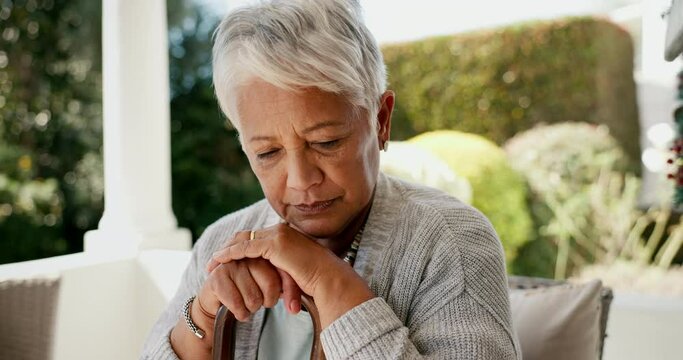 Old woman, walking stick and thinking as widow in retirement or depression in mental health, pain or sad. Elderly person, grief and healing as pensioner in home or memories, nostalgia or remembering