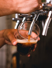 Fototapeta na wymiar Close-Up of Beer Being Served by Bartender