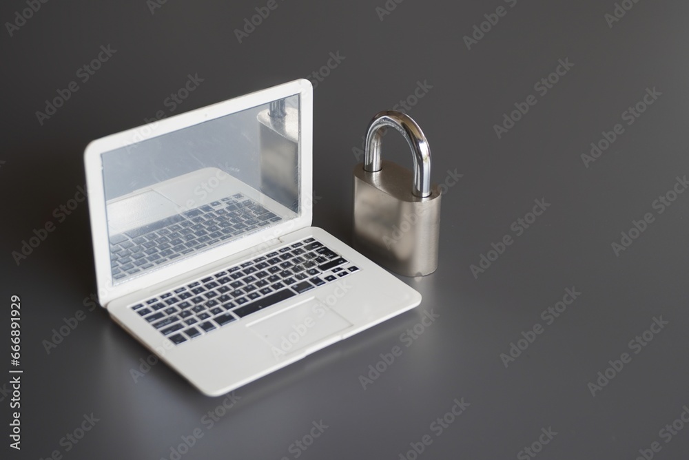 Sticker closeup image of laptop and padlock with copy space. cyber security concept.
