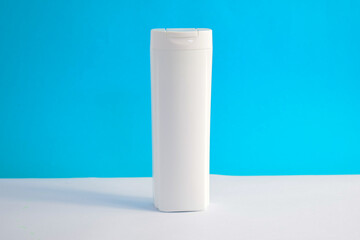 White Bottle shampoo blank for mock up with blue background, beauty health care mockup bottle.