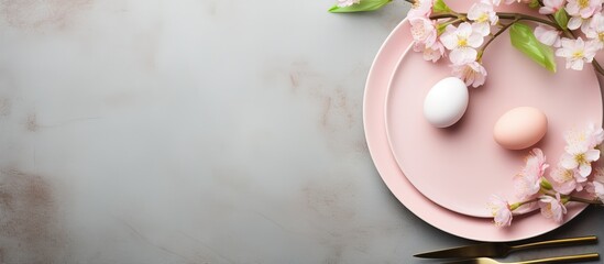 Table with Easter themed plates and cutlery including eggs and flowers
