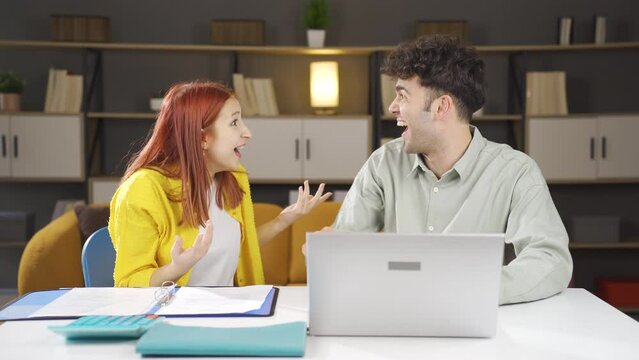 Married Couple Working From Home Office.