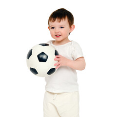 Happy baby holding a soccer ball on a studio, isolated on white background. Smiling child playing football, isolated on white background. Kid about two years old (one year nine months)