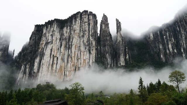 Rainy clouds moving around mountains and covering everything finally, 4k time lapse footage, Enshi valley in Hubei province.