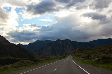 Empty asphalt road in mountains, beautiful landscape of Altay, nature light, road trip in Altai