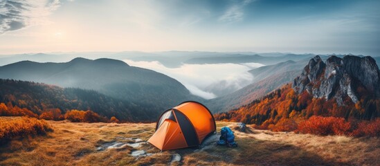 Autumn camping in the peaceful mountains offers an active and tranquil outdoor experience - obrazy, fototapety, plakaty