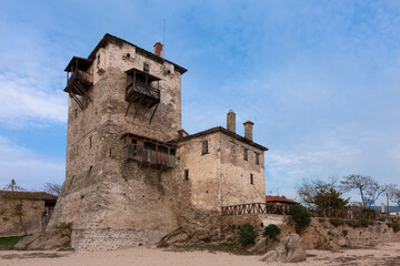 Fototapeta premium The old tower in Ouranoupoli village, Chalkidiki, Greece