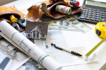 The model house with dollar banknotes background 