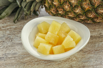 Marinated pineapple slices in the bowl