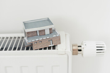 House model on the heating radiator.