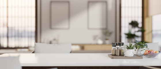 Copy space on a luxury white dining table with a blurred background of a modern white kitchen.