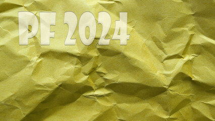Happy New Year 2024 on yellow crumpled up paper.Greeting and new year celebration.