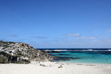 Beautiful coastal image of Rottnest Island off the West Australian coast.  Showing clear water, waves, limestone rocks and vegetation
