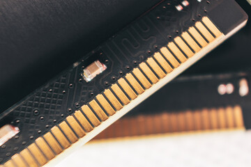 DDR4 DRAM memory module golden electrical contact macro. Computer RAM chipset hardware close-up....