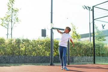 Nice girl with racket in hands playing game of tennis