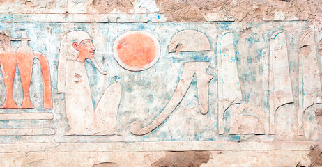 Ancient Colorful Mural Wall Painting inside Hatshepsut Temple in Valley of the Kings, Luxor, Egypt. Ancient Egyptian hieroglyphs, wall of the Hatshepsut temple in Western Thebes