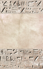 Vertical background with ancient Egyptian hieroglyphs on stone wall, Egypt, Africa. Backdrop with...