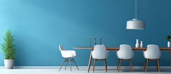 Blue painted wall in modern apartment with table and chairs in spacious dining room