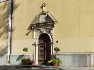 Entrance at the Parish Church of Saint Anastasia with a cloudy sky in the background in the town of Samobor, Croatia
