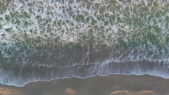 Aerial drone footage of beautiful beach and waves