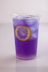 Es Teh Bunga Telang Lemon or Ice Lemon Butterfly Pea Flower Tea Isolated on White