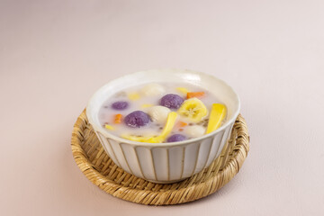 Ginataang Bilo Bilo or Ginataang Halo Halo is a Popular Filipino Dessert, Made with Glutinous Rice Balls, Bananas, sweet Potatoes and Tapioca Pearls Cookes in Sweet Coconut Milk.